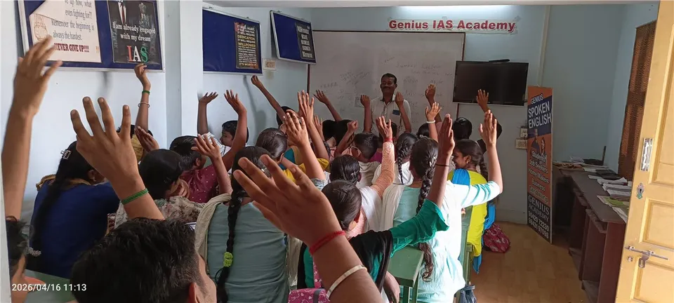 Children raising their hands during a classroom session