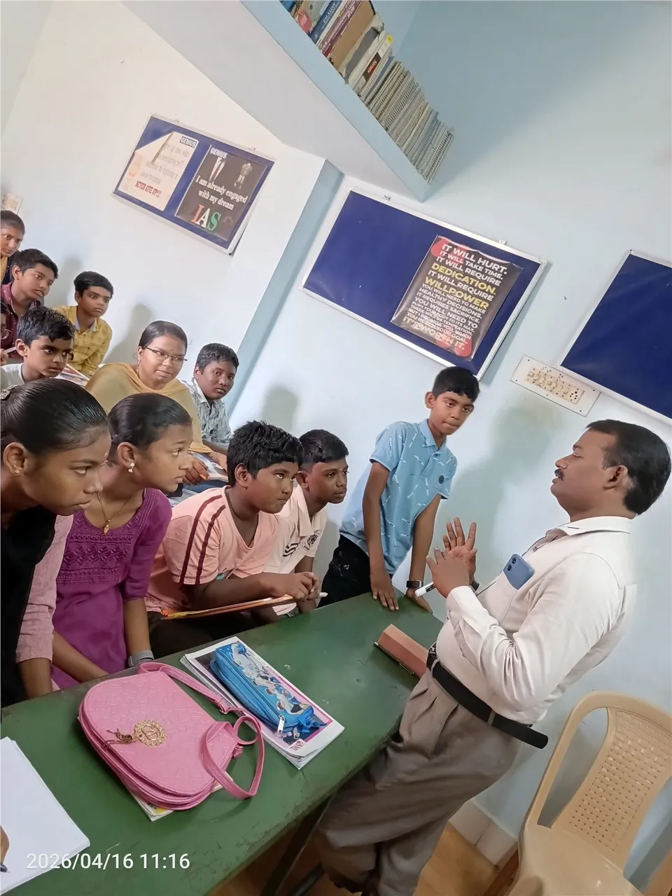 Teacher interacting with children during a classroom activity